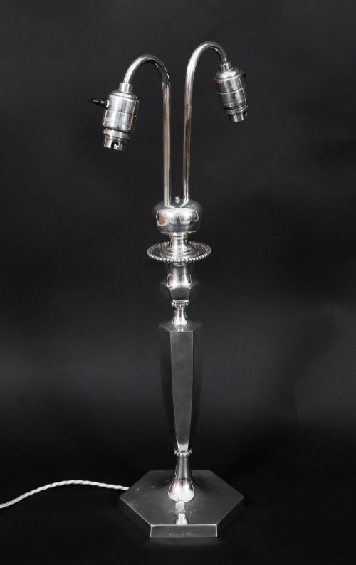 fig 3. An Art Deco silver-plated twin-arm table lamp with a faceted stem and hexagonal base.