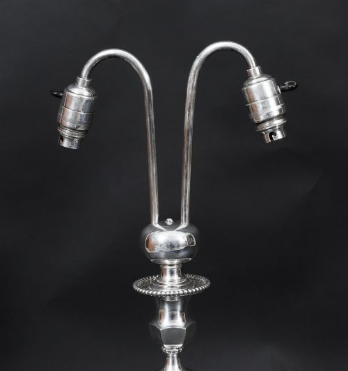 fig 5. An Art Deco silver-plated twin-arm table lamp with a faceted stem and hexagonal base.