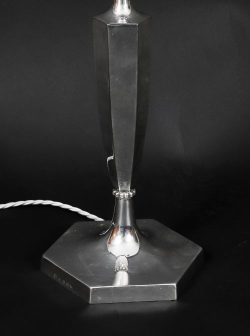 fig 6. An Art Deco silver-plated twin-arm table lamp with a faceted stem and hexagonal base.