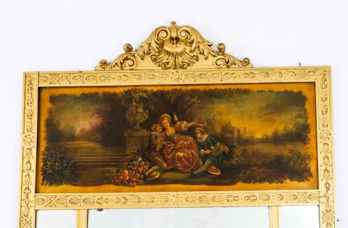 fig 1. An antique French giltwood trumeau mirror with a painted pastoral scene top panel, carved shell cresting, and three glass mirror sections.