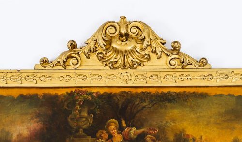 fig 2. An antique French giltwood trumeau mirror with a painted pastoral scene top panel, carved shell cresting, and three glass mirror sections.