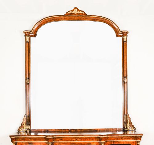 fig 2. A nineteenth-century Victorian burr walnut credenza featuring an arched mirror back, glazed side doors, and a central cupboard inlaid with a porcelain plaque.