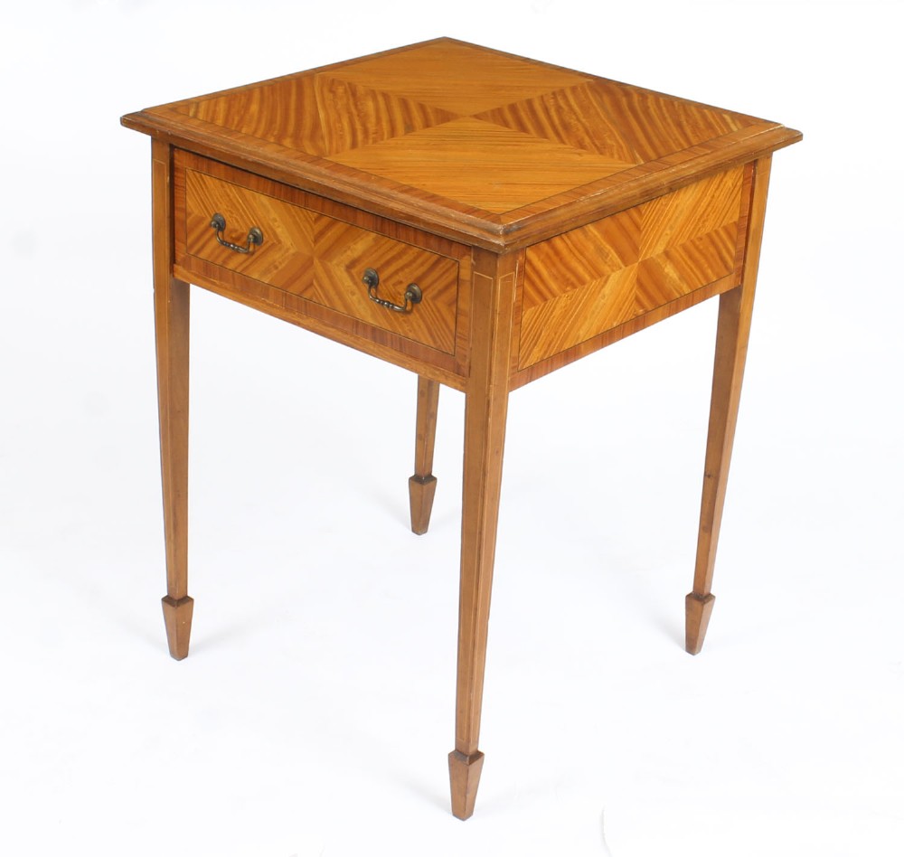 A square Victorian satinwood occasional table featuring a single drawer with brass handles, chevron parquetry top, and four square tapered legs.