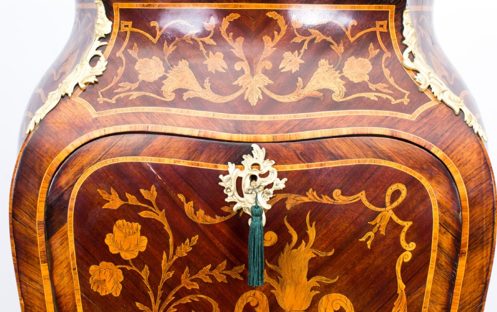 A 19th-century French Rococo Revival secretaire a abattant crafted with floral marquetry, gilt bronze mounts, a contoured silhouette, and a marble top. View III