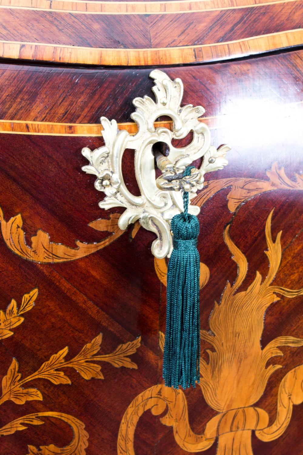 A 19th-century French Rococo Revival secretaire a abattant crafted with floral marquetry, gilt bronze mounts, a contoured silhouette, and a marble top. View IV