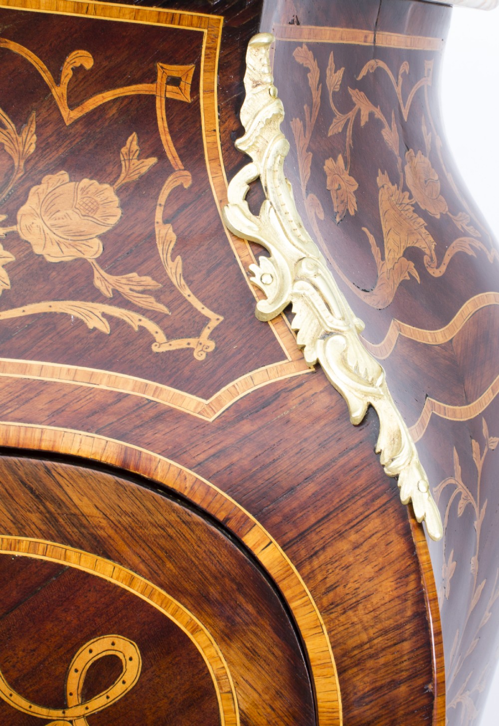A 19th-century French Rococo Revival secretaire a abattant crafted with floral marquetry, gilt bronze mounts, a contoured silhouette, and a marble top. View VI