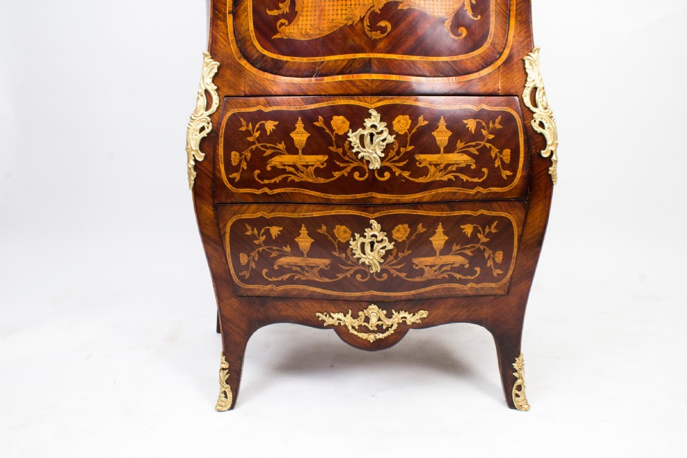 A 19th-century French Rococo Revival secretaire a abattant crafted with floral marquetry, gilt bronze mounts, a contoured silhouette, and a marble top. View VIII