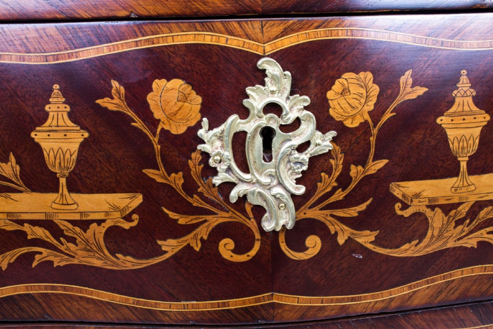 A 19th-century French Rococo Revival secretaire a abattant crafted with floral marquetry, gilt bronze mounts, a contoured silhouette, and a marble top. View IX