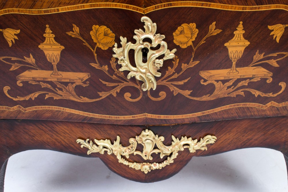 A 19th-century French Rococo Revival secretaire a abattant crafted with floral marquetry, gilt bronze mounts, a contoured silhouette, and a marble top. View XI