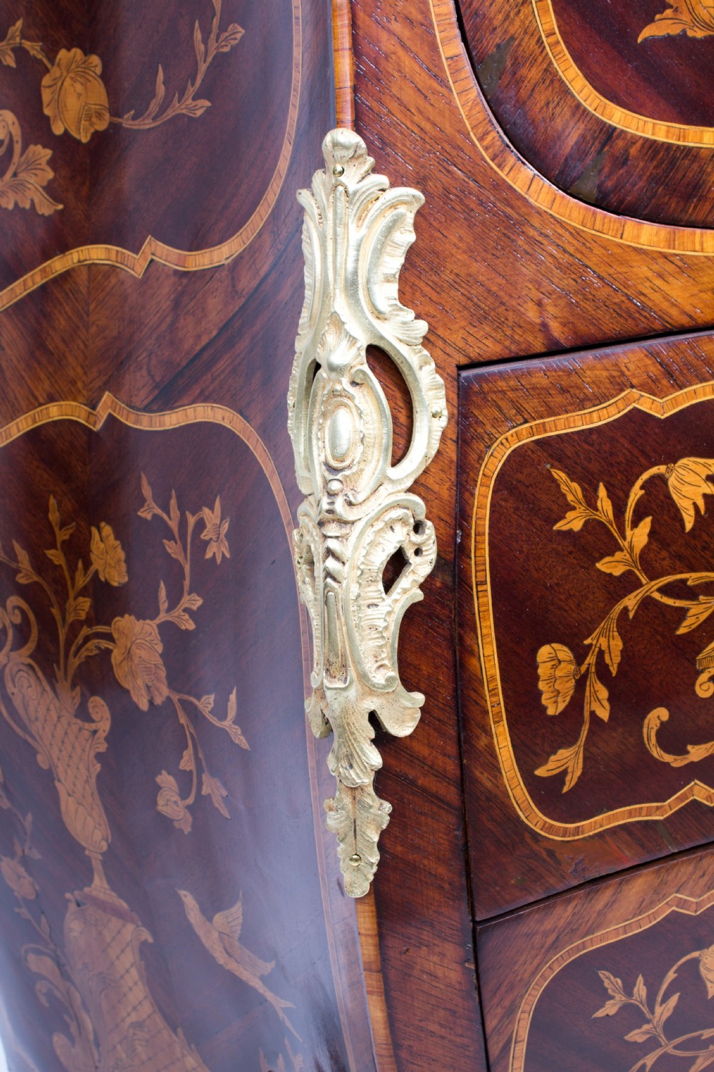 A 19th-century French Rococo Revival secretaire a abattant crafted with floral marquetry, gilt bronze mounts, a contoured silhouette, and a marble top. View XII