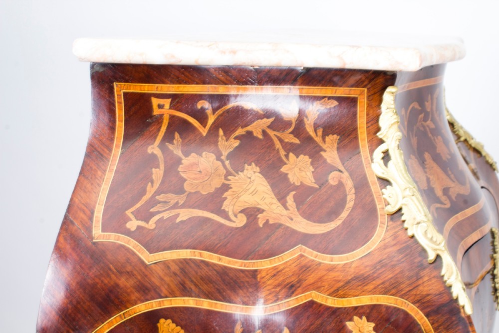 A 19th-century French Rococo Revival secretaire a abattant crafted with floral marquetry, gilt bronze mounts, a contoured silhouette, and a marble top. View XXV