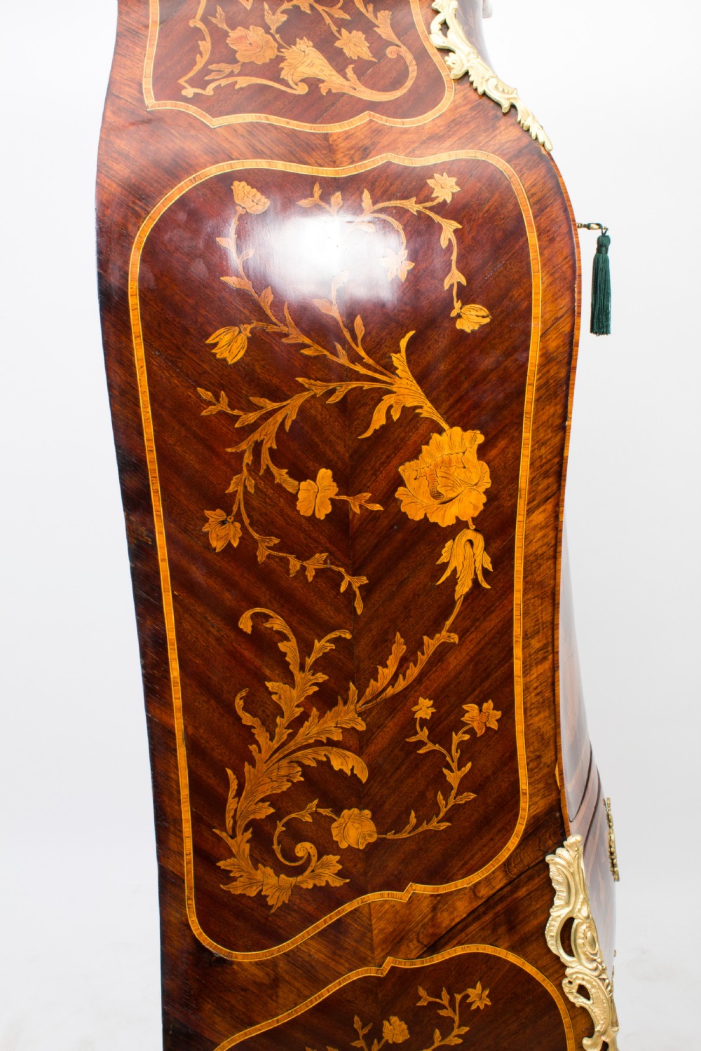 A 19th-century French Rococo Revival secretaire a abattant crafted with floral marquetry, gilt bronze mounts, a contoured silhouette, and a marble top. View XXVII
