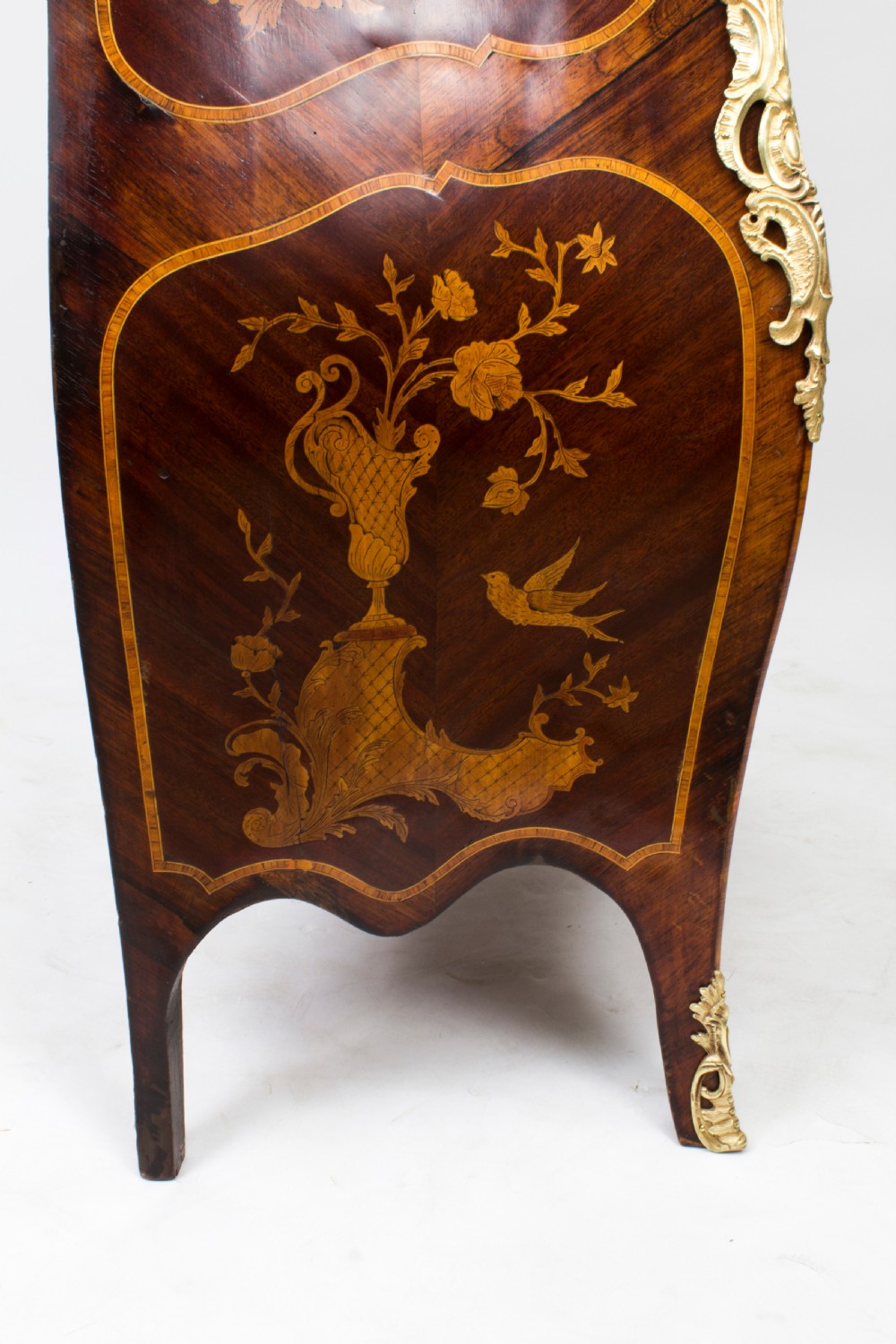 A 19th-century French Rococo Revival secretaire a abattant crafted with floral marquetry, gilt bronze mounts, a contoured silhouette, and a marble top. View XXVIII