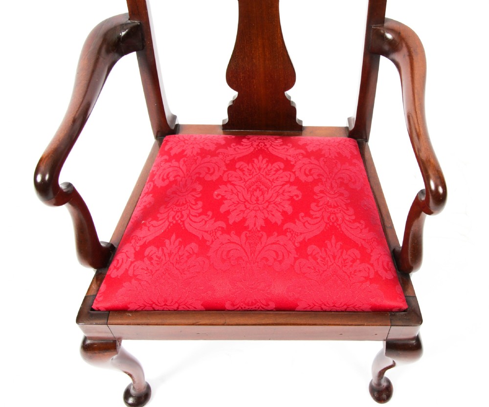 A small dark mahogany Queen Anne style armchair with a vasiform back splat, curved arms, cabriole front legs, and a red damask upholstered seat. View IV