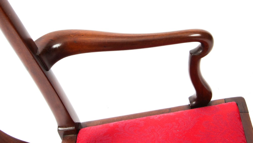 A small dark mahogany Queen Anne style armchair with a vasiform back splat, curved arms, cabriole front legs, and a red damask upholstered seat. View VIII