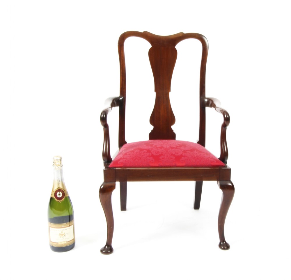 A small dark mahogany Queen Anne style armchair with a vasiform back splat, curved arms, cabriole front legs, and a red damask upholstered seat. View XI