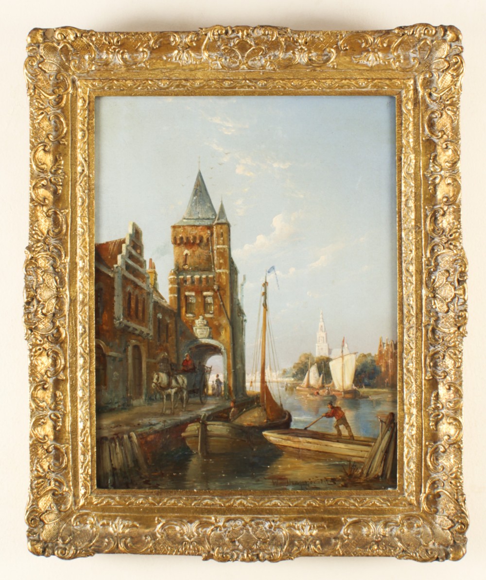 A 19th-century oil painting depicting a Dutch canal scene with gabled buildings, boats, and figures, housed within an ornate gilded frame.