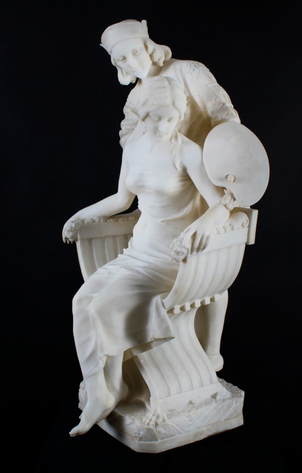A 19th-century white carved alabaster sculpture depicting a seated female figure in drapery with a male figure standing behind her. View III