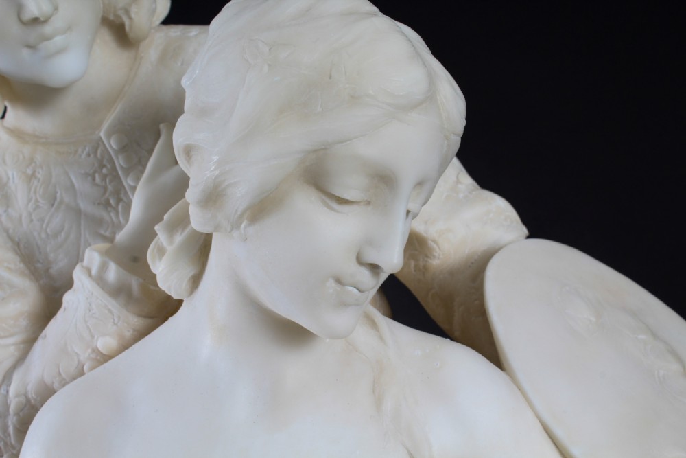 A 19th-century white carved alabaster sculpture depicting a seated female figure in drapery with a male figure standing behind her. View VI
