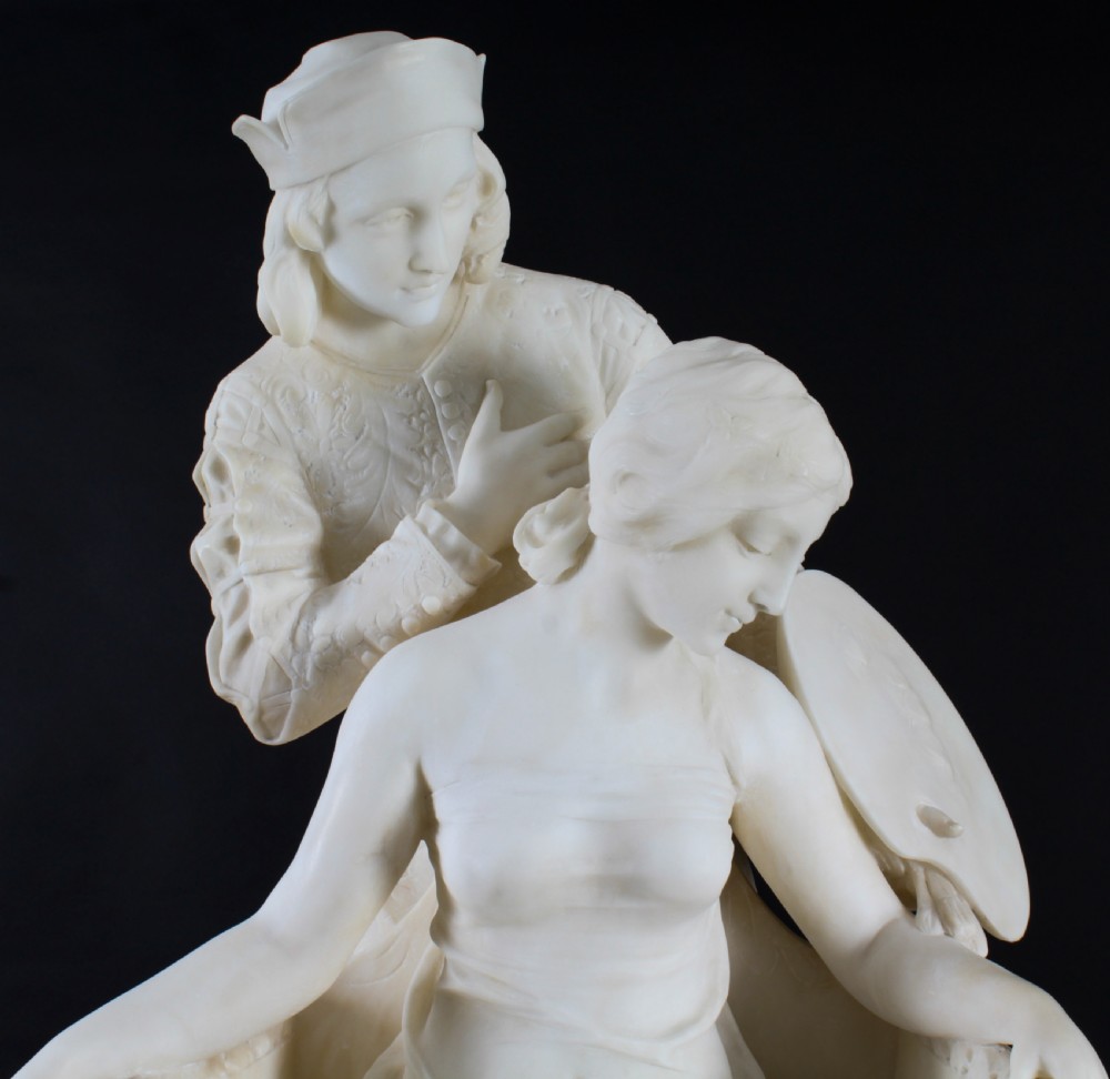 A 19th-century white carved alabaster sculpture depicting a seated female figure in drapery with a male figure standing behind her. View VII