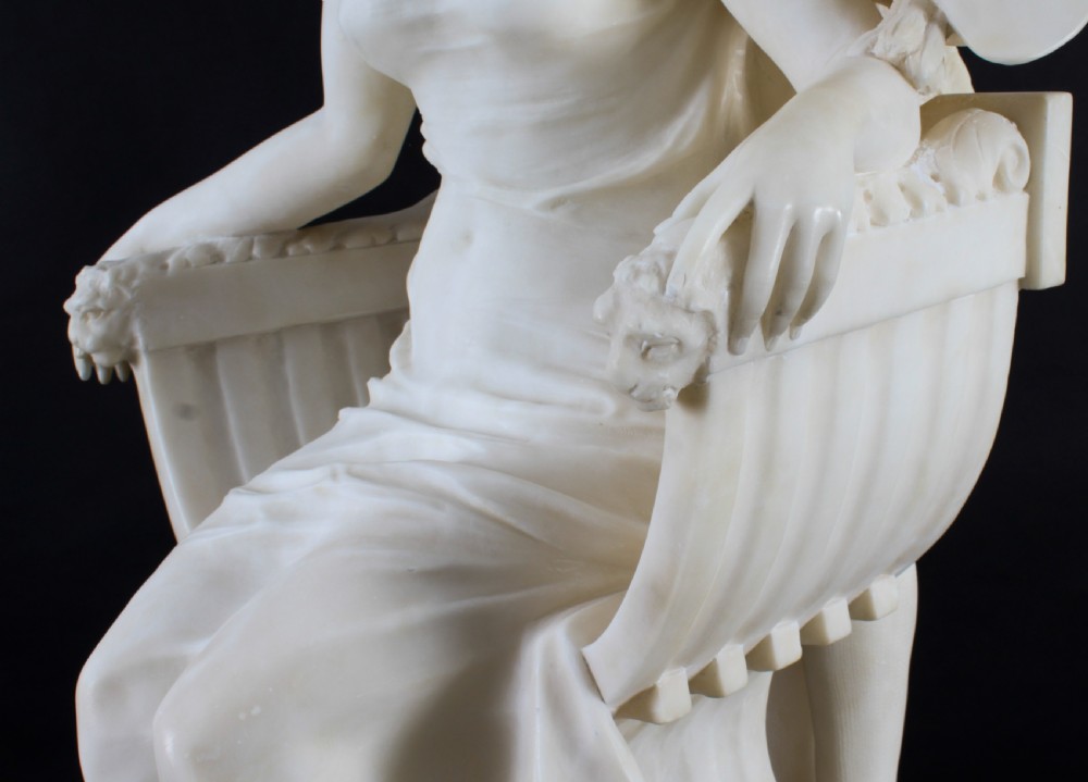 A 19th-century white carved alabaster sculpture depicting a seated female figure in drapery with a male figure standing behind her. View XIII