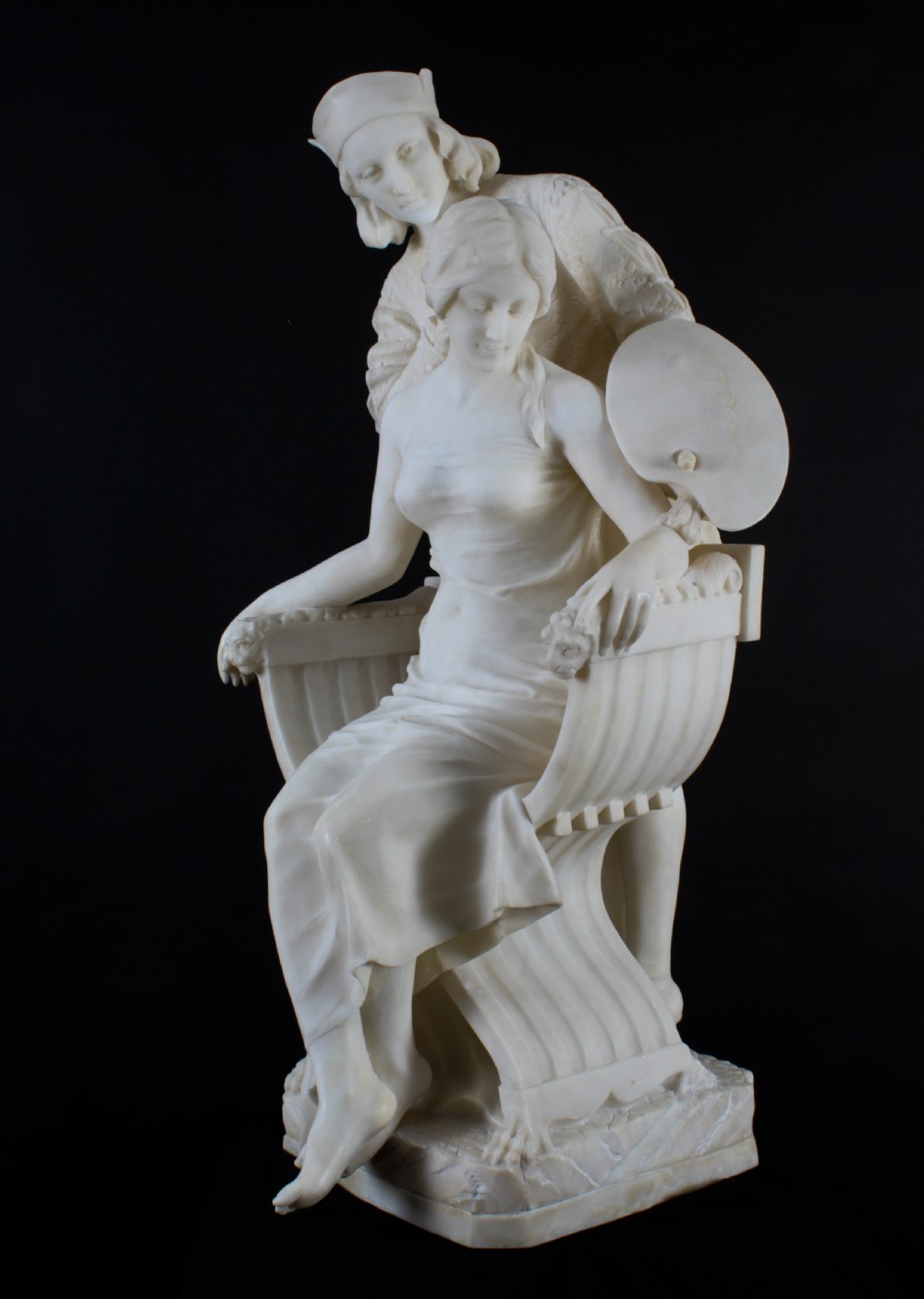 A 19th-century white carved alabaster sculpture depicting a seated female figure in drapery with a male figure standing behind her. View XVI