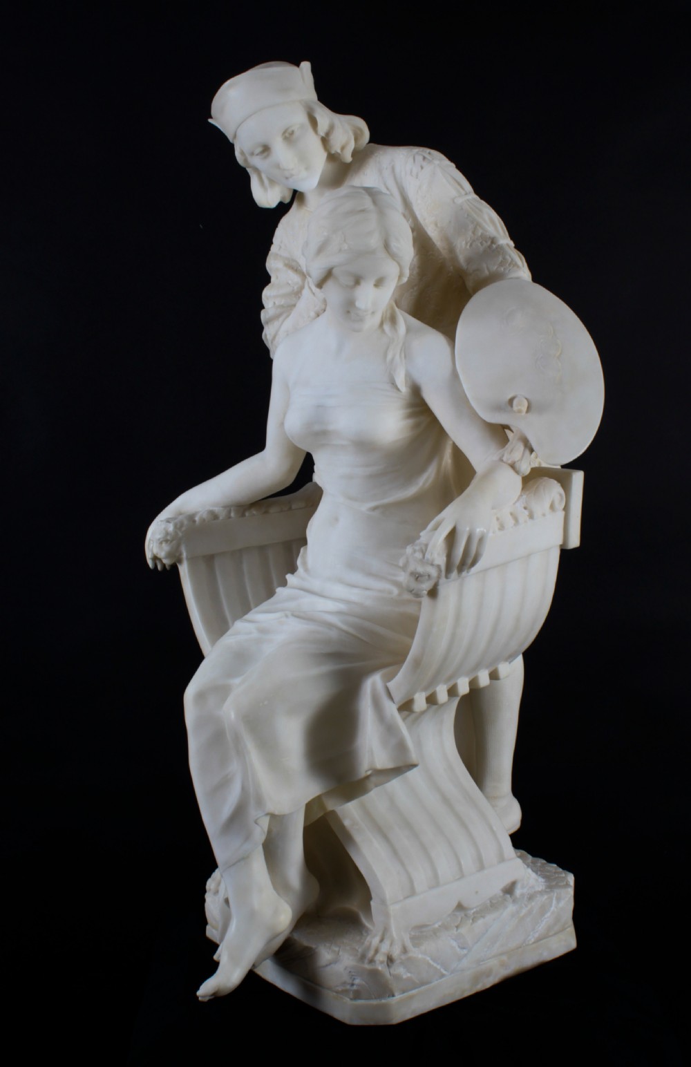 A 19th-century white carved alabaster sculpture depicting a seated female figure in drapery with a male figure standing behind her. View XVIII