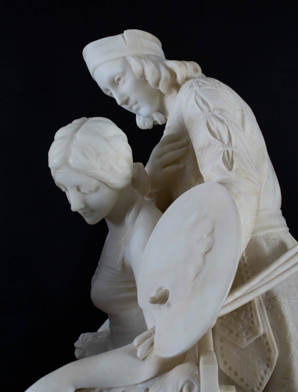 A 19th-century white carved alabaster sculpture depicting a seated female figure in drapery with a male figure standing behind her. View XXII