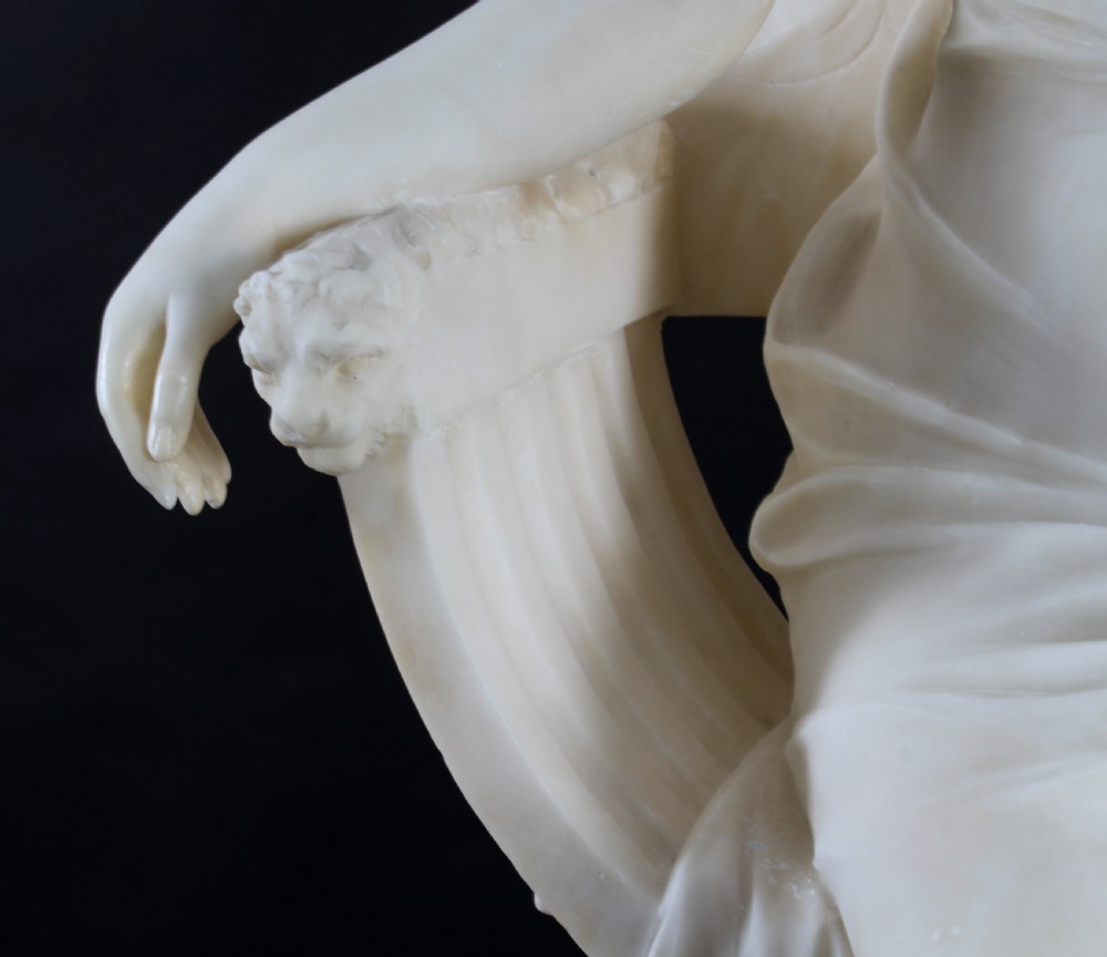 A 19th-century white carved alabaster sculpture depicting a seated female figure in drapery with a male figure standing behind her. View XXIII