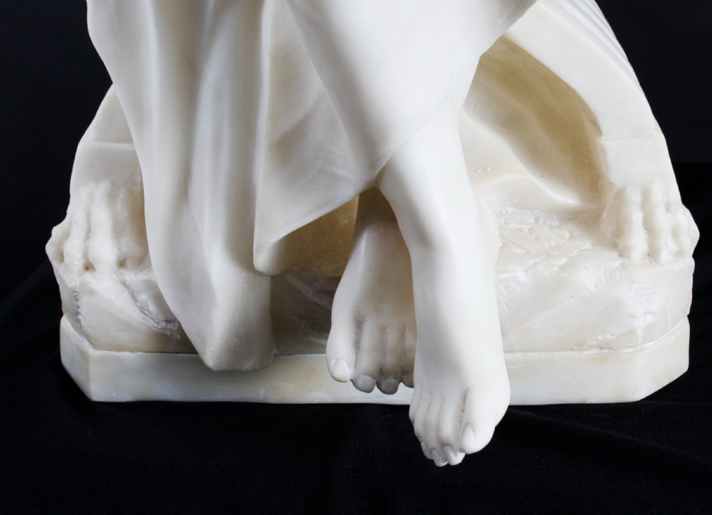 A 19th-century white carved alabaster sculpture depicting a seated female figure in drapery with a male figure standing behind her. View XXIV