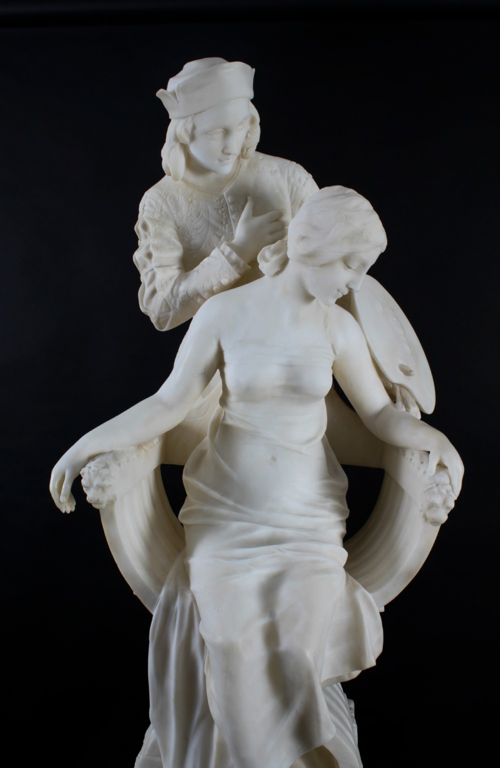 A 19th-century white carved alabaster sculpture depicting a seated female figure in drapery with a male figure standing behind her. View XXVII