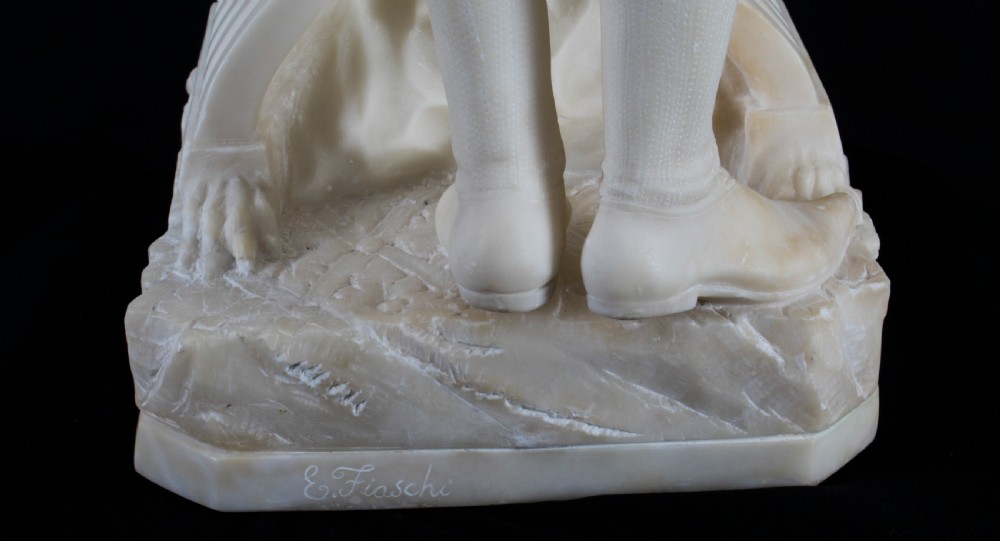 A 19th-century white carved alabaster sculpture depicting a seated female figure in drapery with a male figure standing behind her. View XXVIII