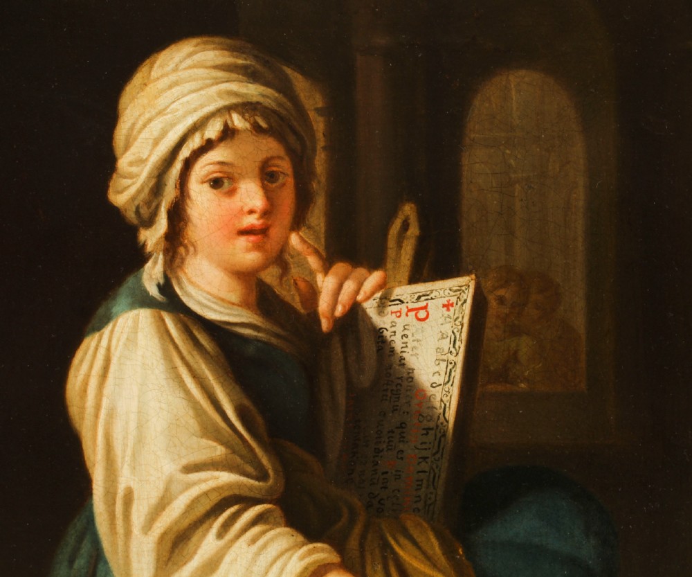 An oil painting depicting a seated young woman wearing a head turban and holding an illuminated scroll, encased in a fluted gold gilded frame. View VI