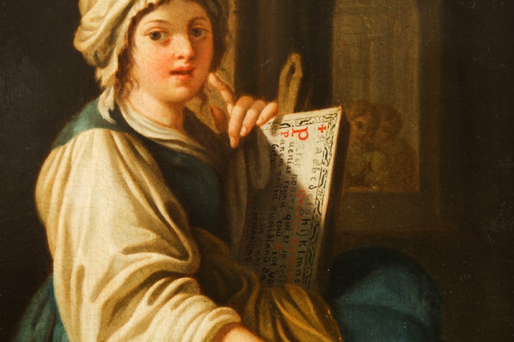 An oil painting depicting a seated young woman wearing a head turban and holding an illuminated scroll, encased in a fluted gold gilded frame. View VII