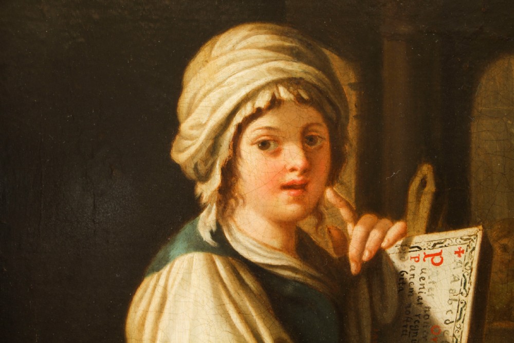 An oil painting depicting a seated young woman wearing a head turban and holding an illuminated scroll, encased in a fluted gold gilded frame. View VIII