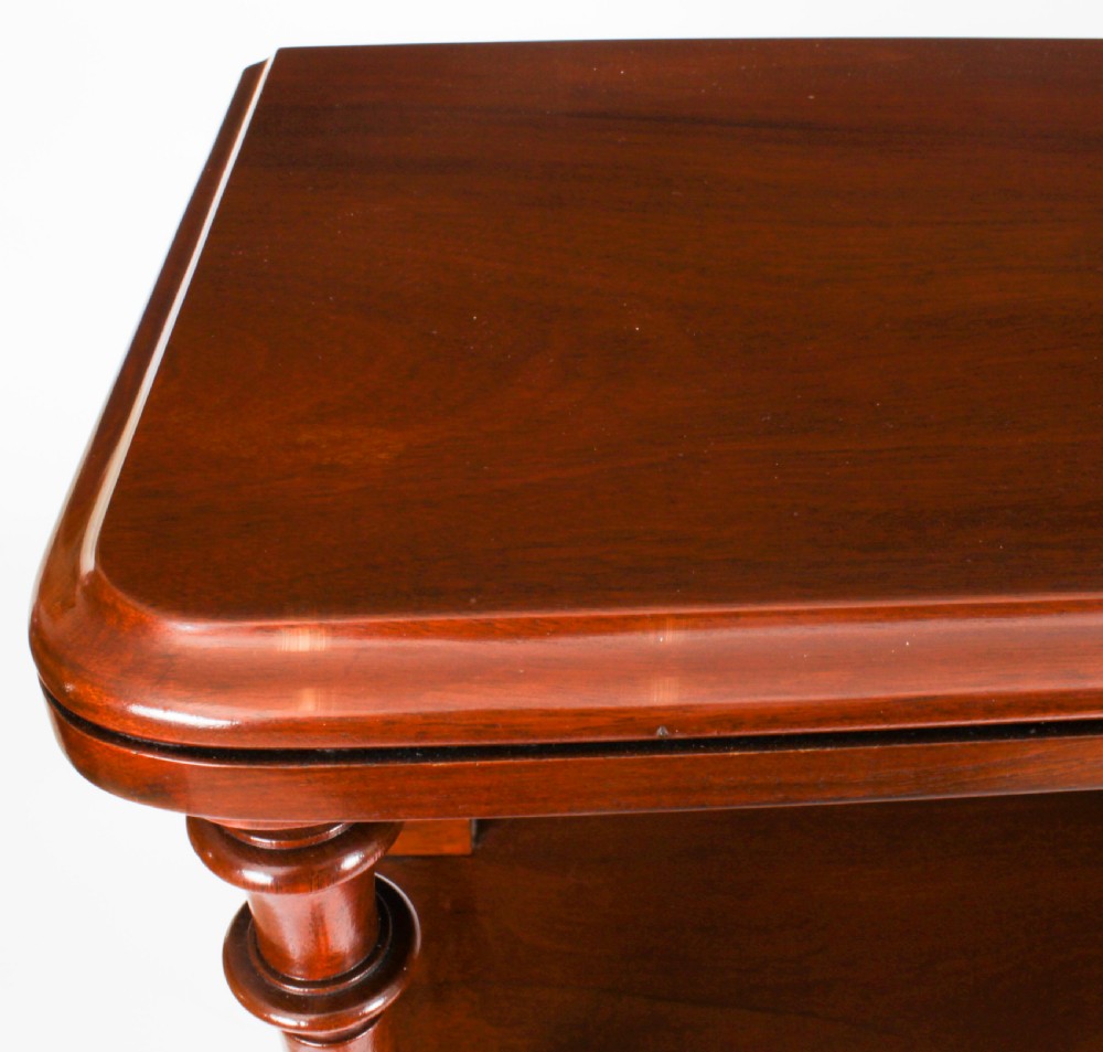A Victorian flame mahogany dry bar featuring an elevated upper shelf supported by four turned balusters over a panelled lower counter. View VIII