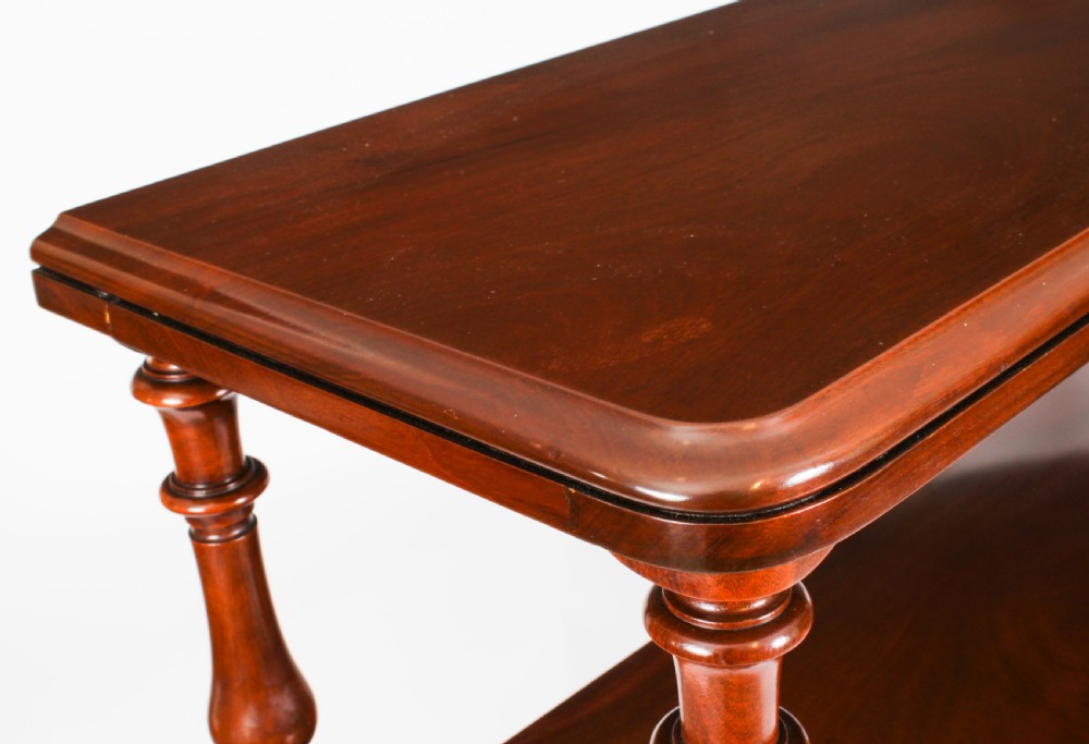 A Victorian flame mahogany dry bar featuring an elevated upper shelf supported by four turned balusters over a panelled lower counter. View XV