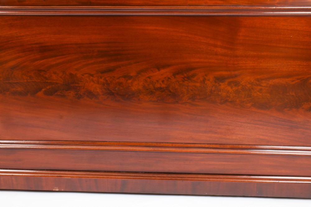 A Victorian flame mahogany dry bar featuring an elevated upper shelf supported by four turned balusters over a panelled lower counter. View XXV