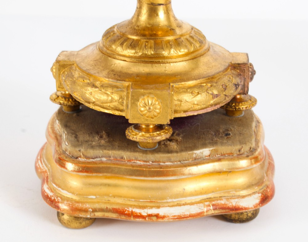 A pair of 19th-century French Sevres-style bleu celeste porcelain urns featuring hand-painted floral and bird reserves, supported by gilt metal mounts and pedestals. View VII