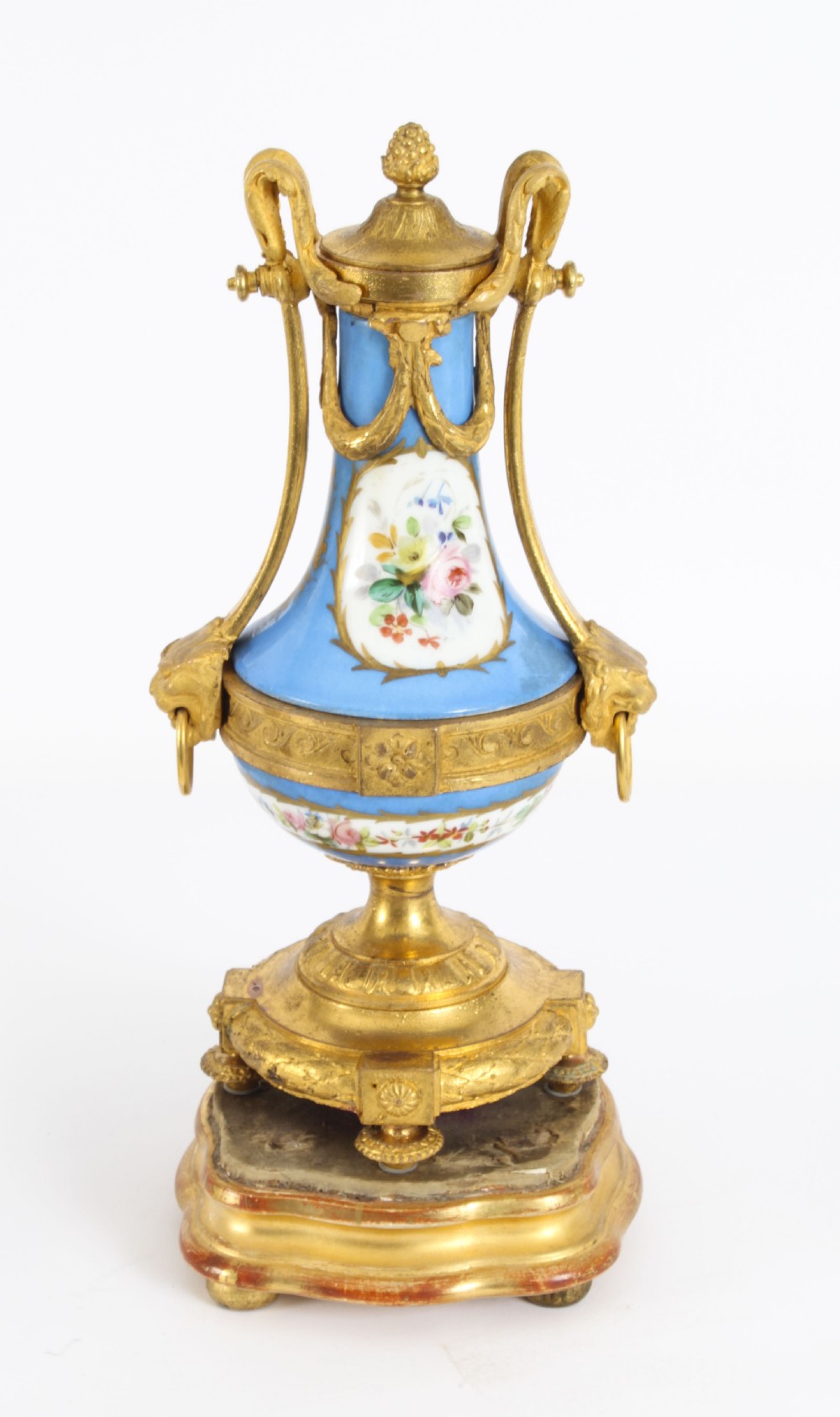 A pair of 19th-century French Sevres-style bleu celeste porcelain urns featuring hand-painted floral and bird reserves, supported by gilt metal mounts and pedestals. View XII
