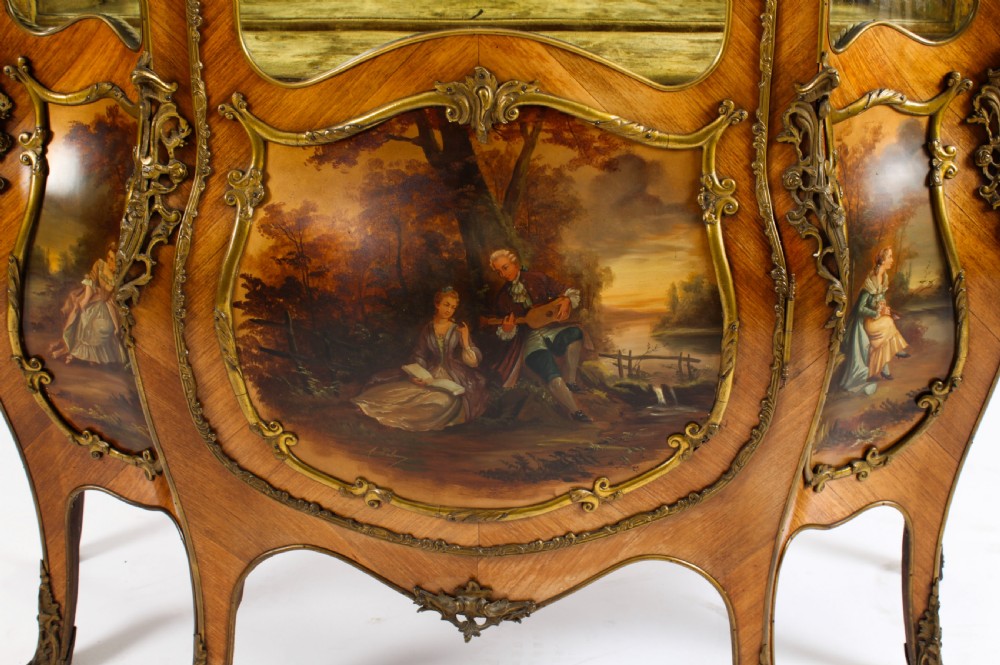 A nineteenth-century French Louis XV style bombee vitrine cabinet featuring curved glass panels, hand-painted Vernis Martin lower sections, and ornate gilt bronze mounts. View IX