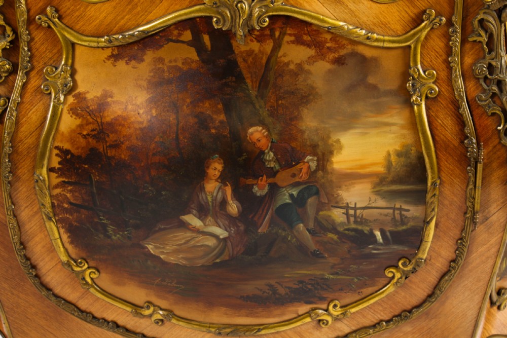 A nineteenth-century French Louis XV style bombee vitrine cabinet featuring curved glass panels, hand-painted Vernis Martin lower sections, and ornate gilt bronze mounts. View XI