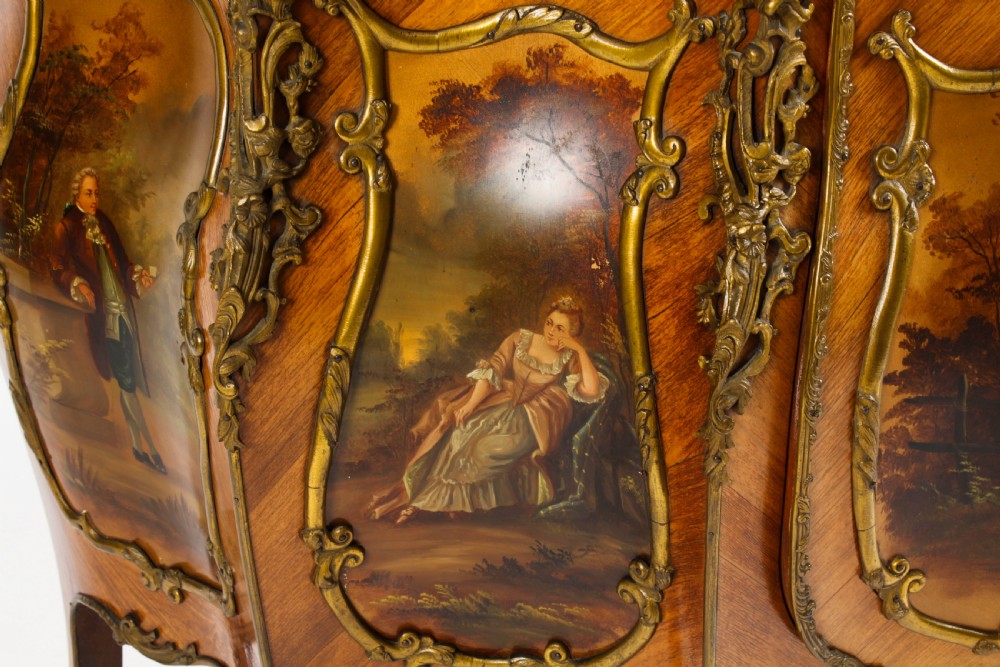 A nineteenth-century French Louis XV style bombee vitrine cabinet featuring curved glass panels, hand-painted Vernis Martin lower sections, and ornate gilt bronze mounts. View XIII