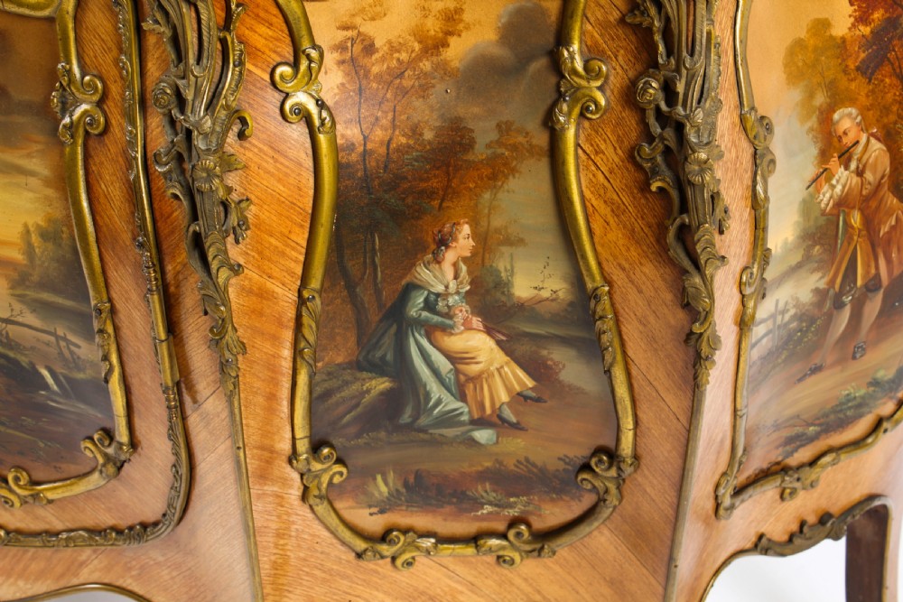 A nineteenth-century French Louis XV style bombee vitrine cabinet featuring curved glass panels, hand-painted Vernis Martin lower sections, and ornate gilt bronze mounts. View XXII