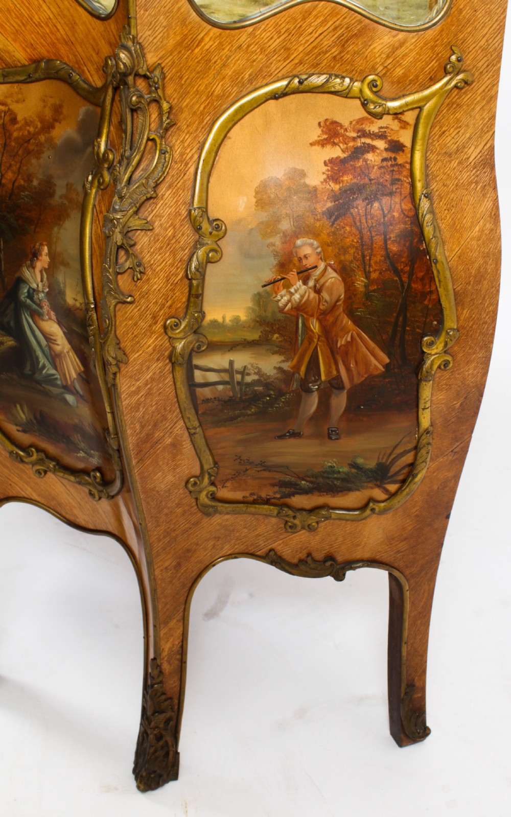 A nineteenth-century French Louis XV style bombee vitrine cabinet featuring curved glass panels, hand-painted Vernis Martin lower sections, and ornate gilt bronze mounts. View XXIV