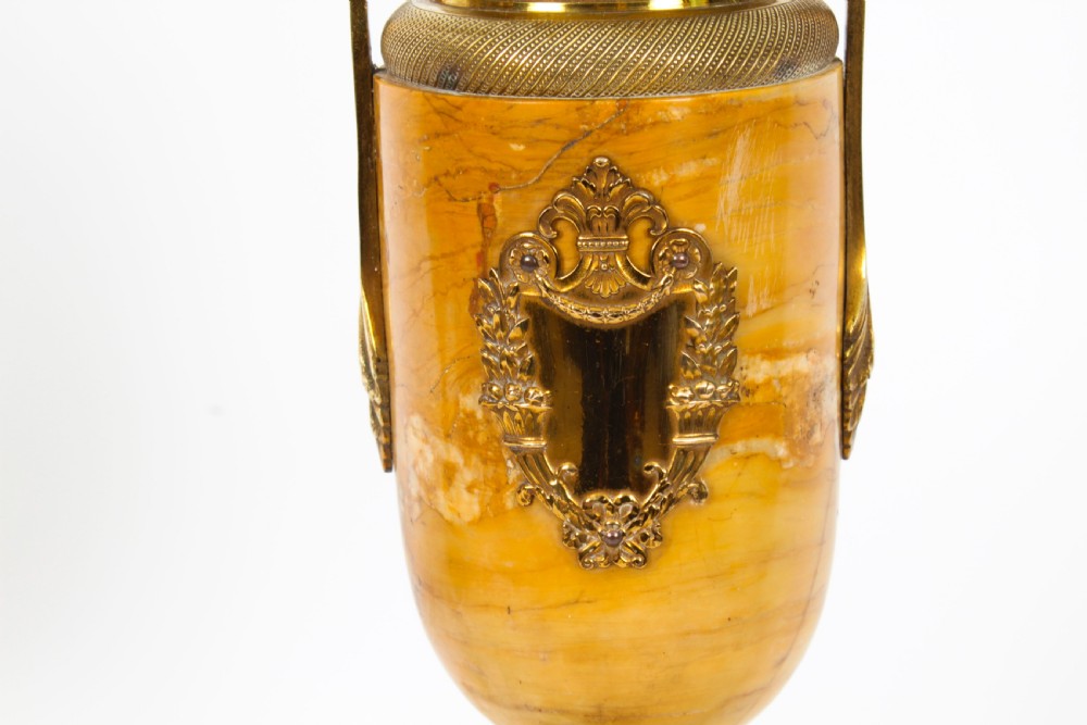 A pair of 19th-century French urn-form Siena marble table lamps featuring detailed gilt bronze mounts and handles. View XIV