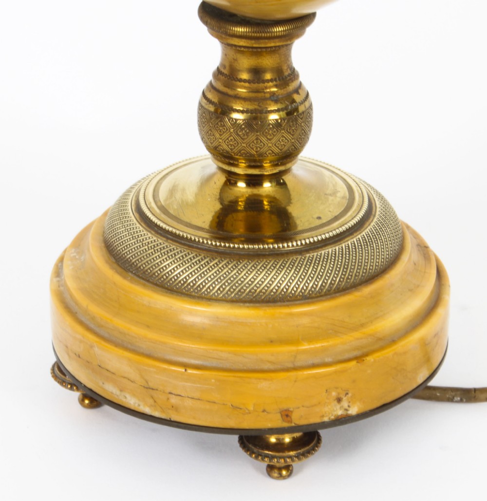 A pair of 19th-century French urn-form Siena marble table lamps featuring detailed gilt bronze mounts and handles. View XV