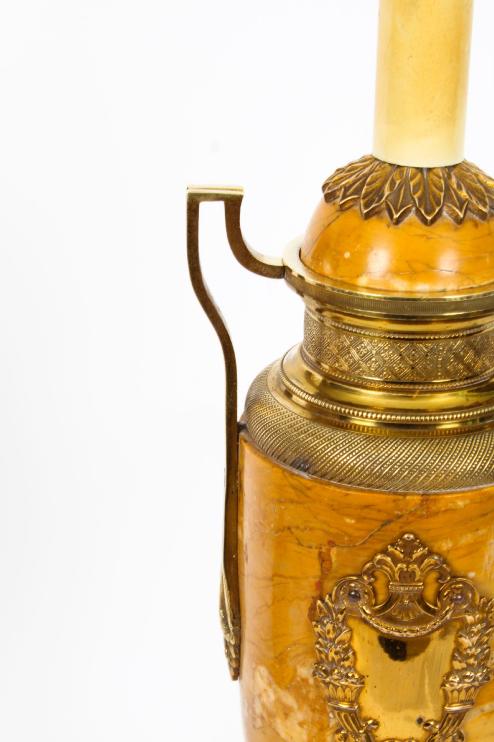 A pair of 19th-century French urn-form Siena marble table lamps featuring detailed gilt bronze mounts and handles. View XVI
