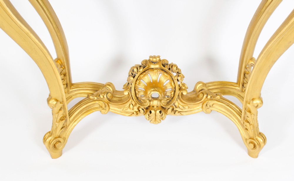 A 19th-century Louis Revival carved giltwood console table with cabriole legs and a dark red marble top. View XIV