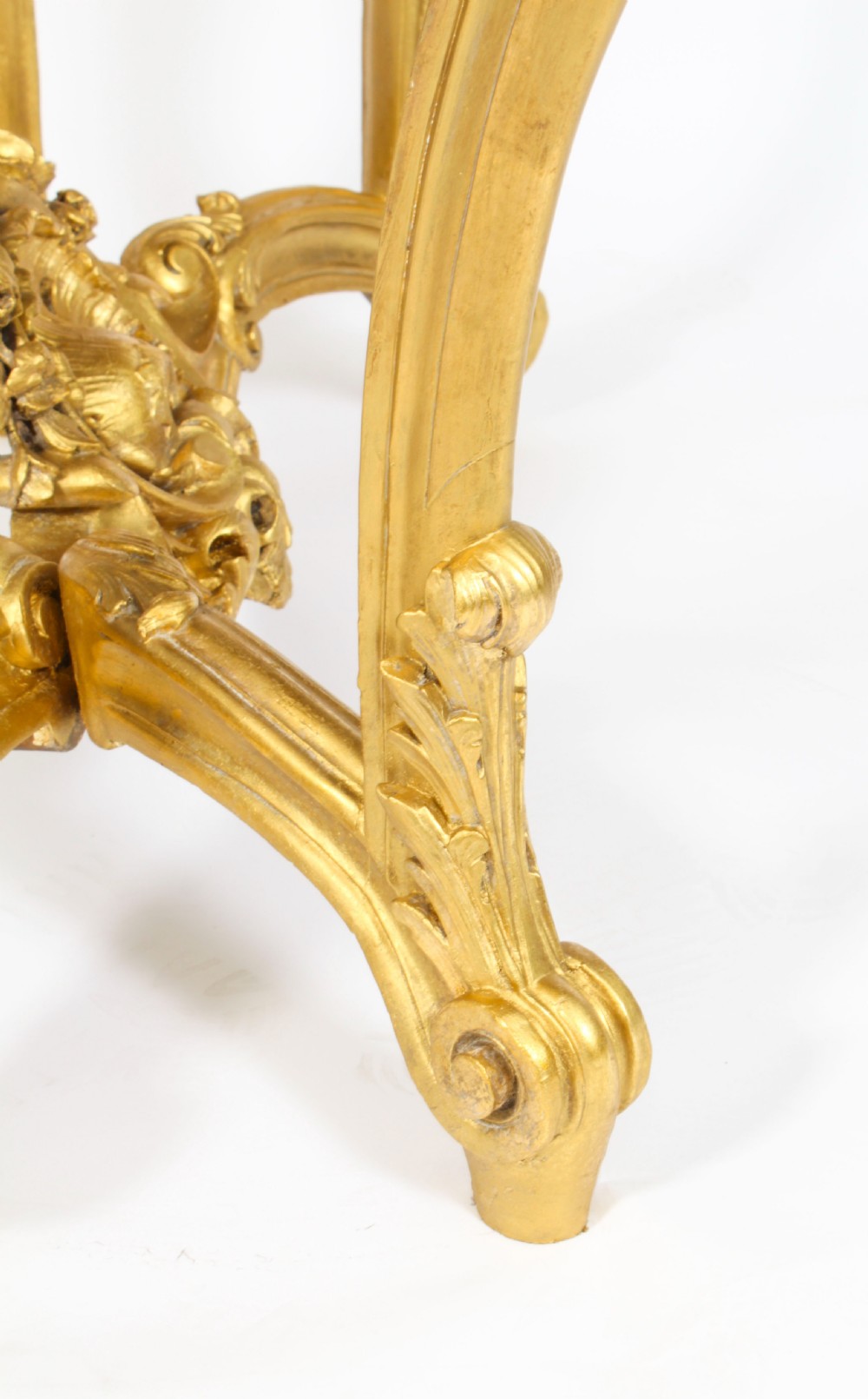 A 19th-century Louis Revival carved giltwood console table with cabriole legs and a dark red marble top. View XVII